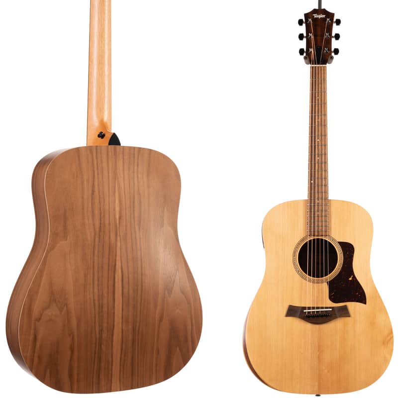 A natural wood acoustic guitar standing upright on a surface.