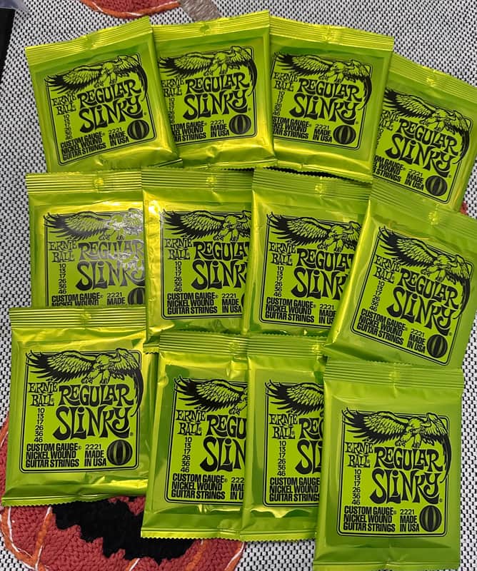 New Ernie Ball regular slinky guitar strings 12 SETS! image 1