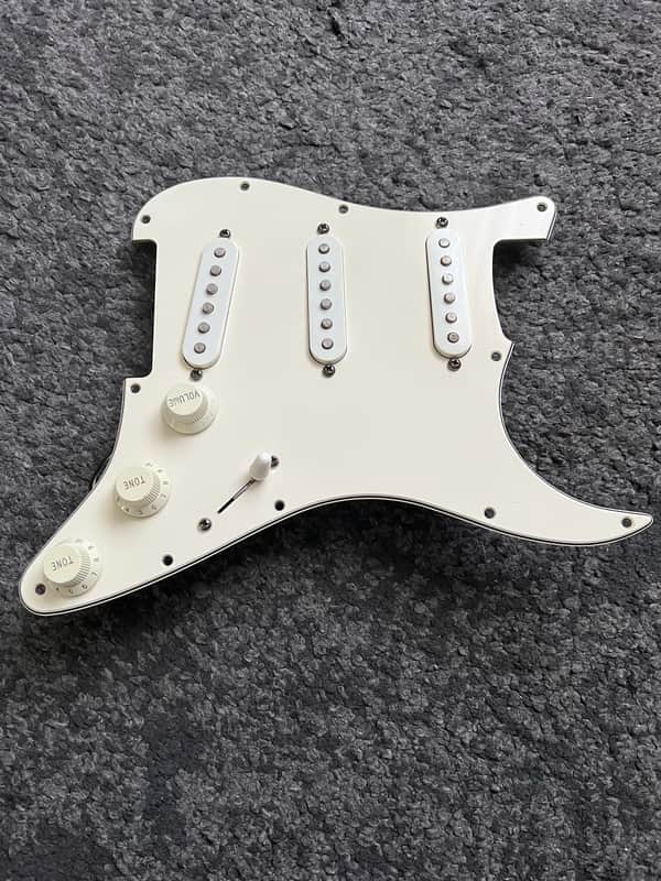 Complete pickguard from a 1996 Fender Standard Stratocaster MIM image 1