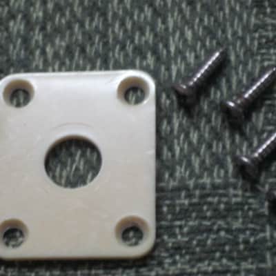 used (has some nicks & scratches) unknown brand CREME PLASTIC RECTANGLE Jack Plate + nickel finish SCREWS (refer to measurements in description) flat - but will flex when installed, might fit Epiphone LP 100 model guitar (NO guitar included) image 1