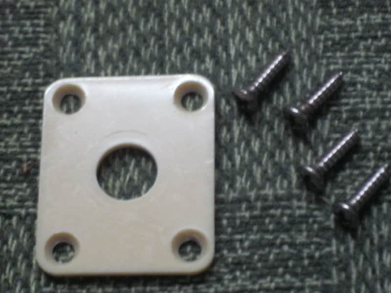used (has some nicks & scratches) unknown brand CREME PLASTIC RECTANGLE Jack Plate + nickel finish SCREWS (refer to measurements in description) flat - but will flex when installed, might fit Epiphone LP 100 model guitar (NO guitar included) image 1