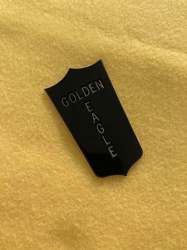 NOS-Heritage Golden Eagle Tailpiece Emblem / Shield 1985 - Black / White plastic engraved image 1