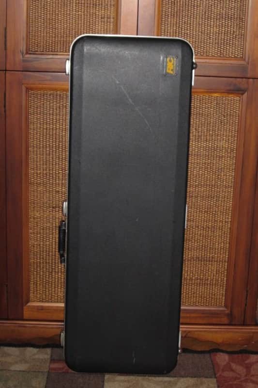 used Rickenbacker Hardshell Case for Model 620 electric guitar (NO guitar) from 1995, 2 Ball feet broke off (2 holes in plastic), Exterior plastic has some cracks,  EXT: Black Hard Plastic / Chrome HW / Handle: Black Molded Hard Plastic / INT: Blue Plush image 1