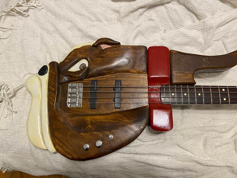 Very unique bass guitar. Hand made carved bull dog body image 1
