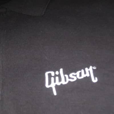new (old stock) with hang tag (A+) genuine Gibson Black, 100% Cotton, Polo Style Short Sleeve Shirt, size M (medium) Manufacturers Item No: SGGABLMPOLOMD from the 2010s (but it is new) UPC # 711106561400 image 2