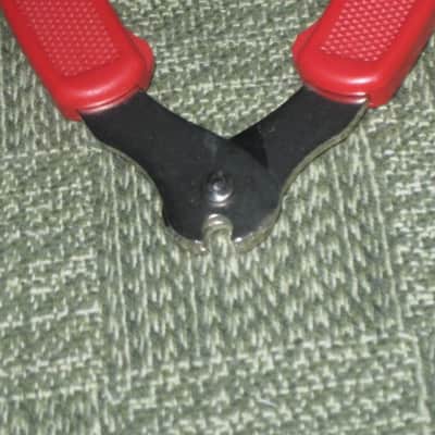 new old stock open package A+ D'Addario / Planet Waves 1st ver Pro-Winder RED String Winder & Cutter & Bridge PIn Puller, has different handle design than current DP0002 model,  from 2000s - for guitars, banjos, ukuleles, and mandolins image 13
