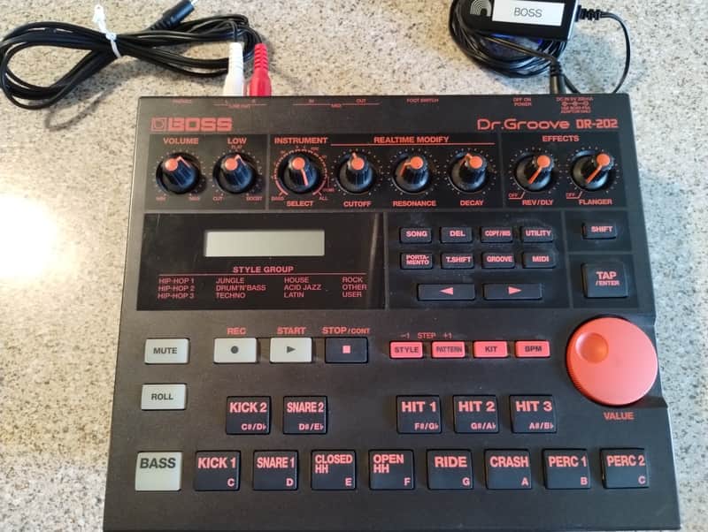 Black and red BOSS Dr Groove DR-202 drum machine with knobs and buttons.