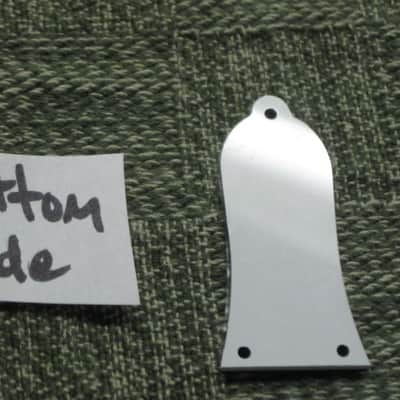 open package (near A+) unknown brand Epiphone 3 Hole Truss Rod Cover, blank (NO info), 2 ply (black front side / white bevelled edge, & white back side), bell shape + silver screws (TOP SIDE of cover has clear plastic over it), from 2020s image 5