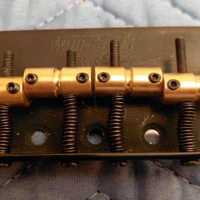 Wilkinson 4-string bass bridge black w/brass saddles, like new image 1