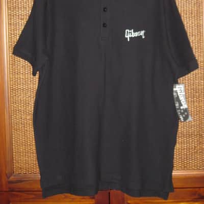 new (old stock) with hang tag (A+) genuine Gibson Black, 100% Cotton, Polo Style Short Sleeve Shirt, size M (medium) Manufacturers Item No: SGGABLMPOLOMD from the 2010s (but it is new) UPC # 711106561400 image 1