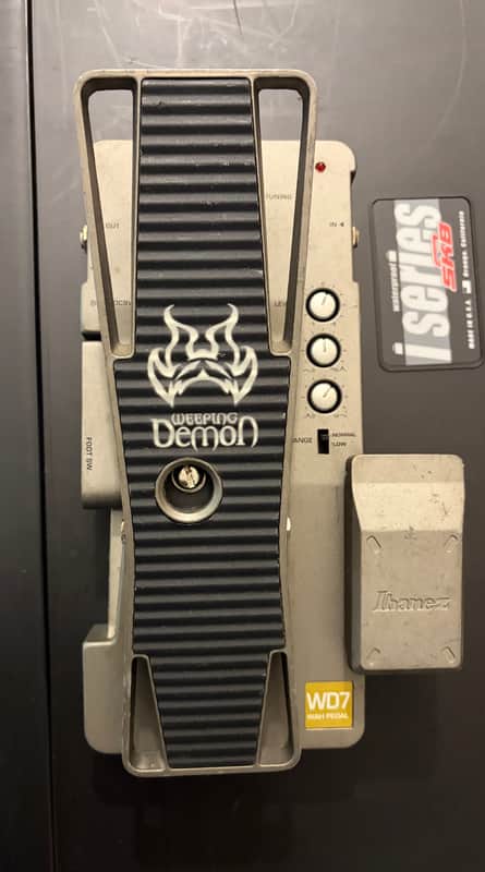 Black and silver electric guitar with "Weeping Demon" logo.