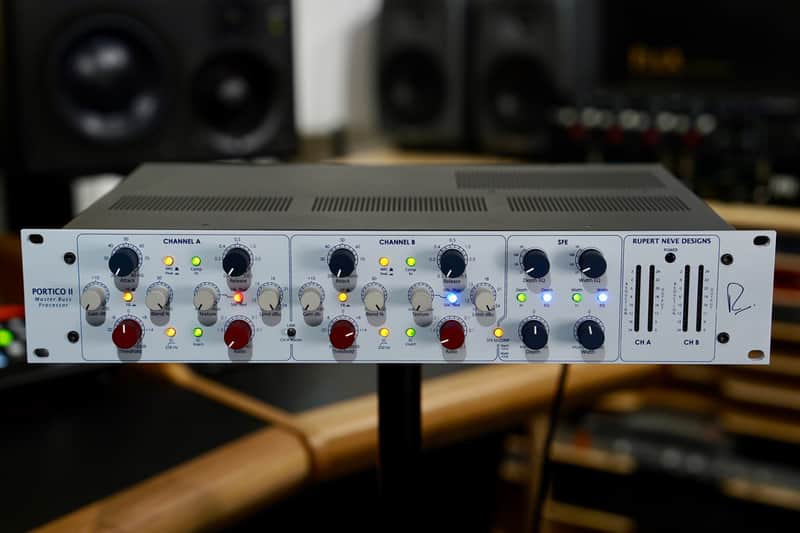 White Rupert Neve Designs audio mixer with channel controls and meters.