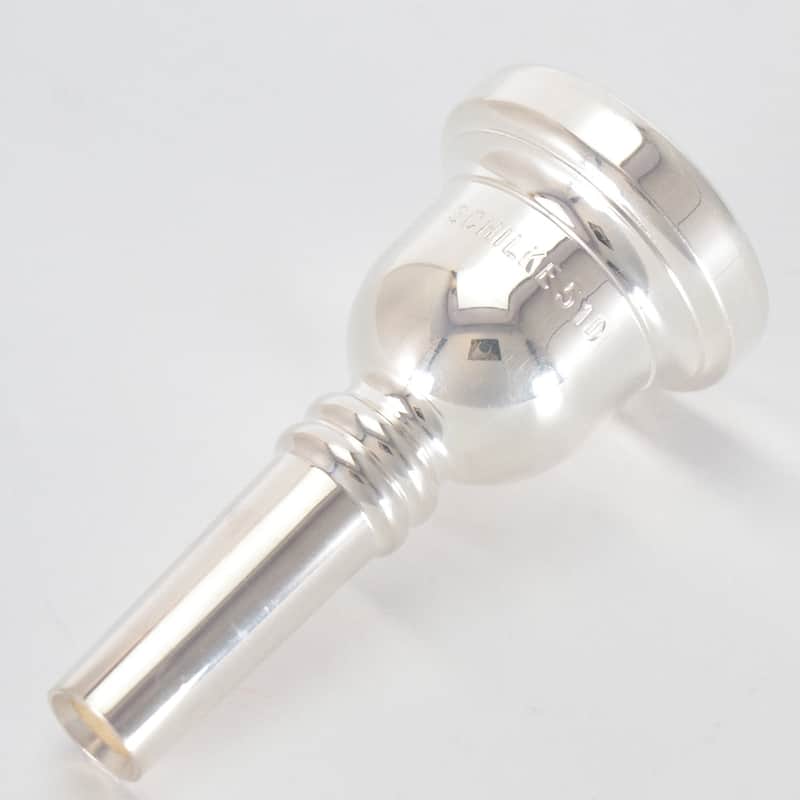 Clear plastic collectible with silver cap, showing "SCROLL KE 610" inscription.