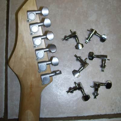 Guitar machine head or pegs, new. image 1