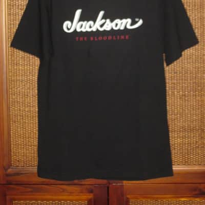 new genuine Jackson (by Fender) Jackson Bloodline 100% Cotton Black Short Sleeve T-Shirt, Medium (M), GRAPHIC: White & Red -- P.N (part #): 0990264406 (NO: hangtag / packaging) image 1