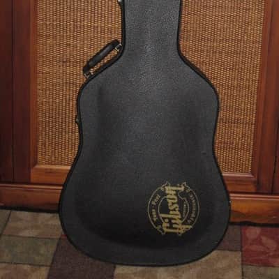 used genuine Gibson Dreadnought Hardshell Case from 2000s - Black Tolex Exterior, Wood Construction, Blue Plush Padded Interior, Gold Colored Hardware, lid has Gibson Acoustic Logo, fits square / round shoulder & cutaway dreadnought (NO guitar included) image 1