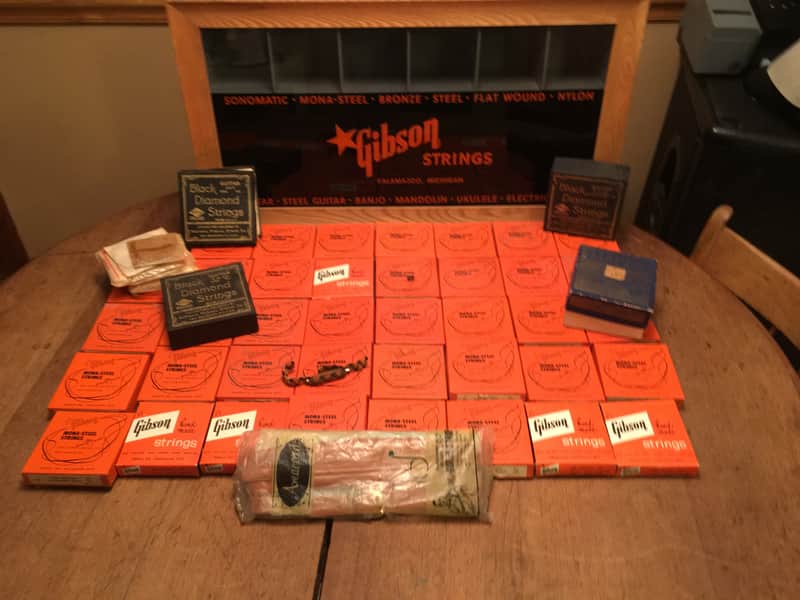 Gibson String Display case 1950's -60's orange and black full of unused strings image 1