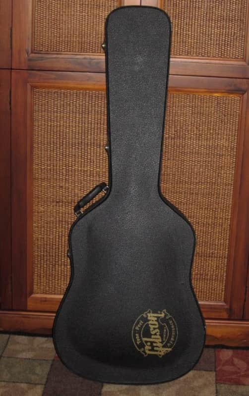 used genuine Gibson Dreadnought Hardshell Case from 2000s - Black Tolex Exterior, Wood Construction, Blue Plush Padded Interior, Gold Colored Hardware, lid has Gibson Acoustic Logo, fits square / round shoulder & cutaway dreadnought (NO guitar included) image 1
