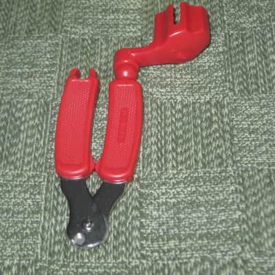 new old stock open package A+ D'Addario / Planet Waves 1st ver Pro-Winder RED String Winder & Cutter & Bridge PIn Puller, has different handle design than current DP0002 model,  from 2000s - for guitars, banjos, ukuleles, and mandolins image 1