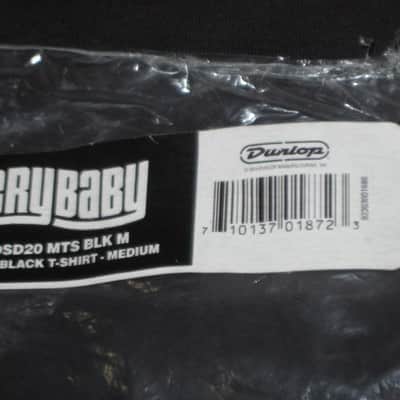 new in package (old stock) A+ genuine Dunlop DSD20-MTS-M Men's Cry Baby T-Shirt, Medium, 100% Cotton, Black, Short Sleeve, CRY BABY Graphic is in White (from 2010s) UPC # 710137018723 image 2