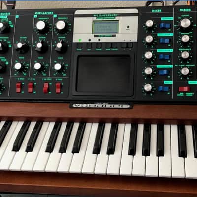 Moog Minimoog Voyager Select Series 44-Key Monophonic Synthesizer 2006 - 2013 - Mahogany Cabinet and Moog Molded ATA Voyager Case - Heavy Duty Travel Case with Wheels