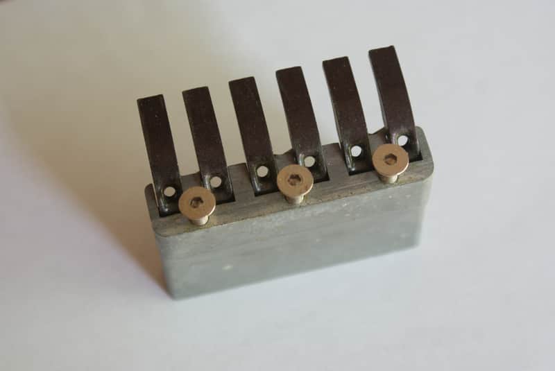 Fender  System One Bridge Block, Tuning Tongues, and Spring 1984-87 Zinc/Blck. image 1