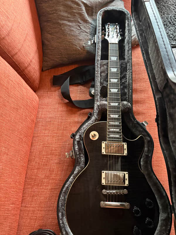 Midnight Ebony Les Paul Tribute Plus for $774.51 - Save Nothing!