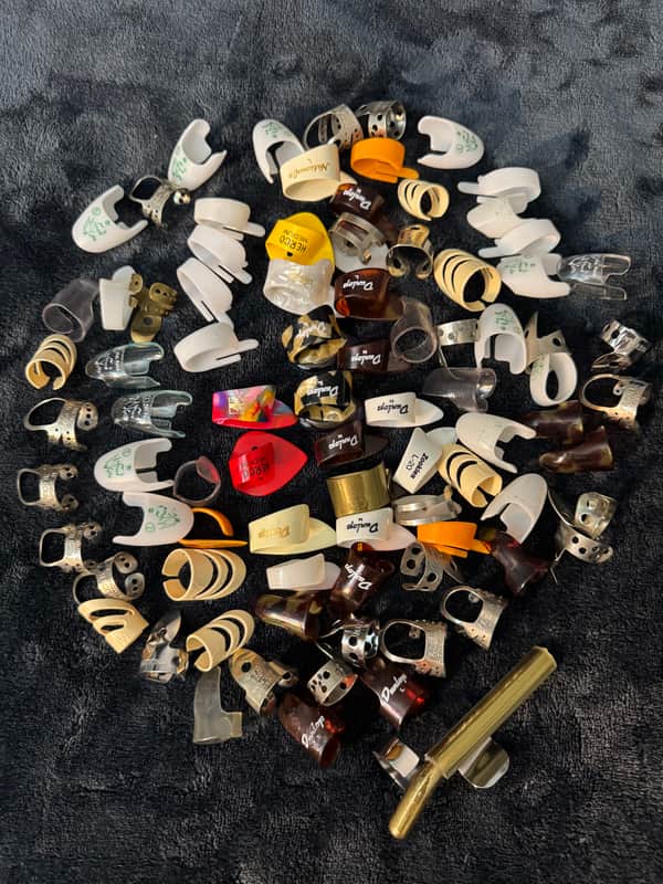 Various Finger picks, Thumb picks and a slide. image 1