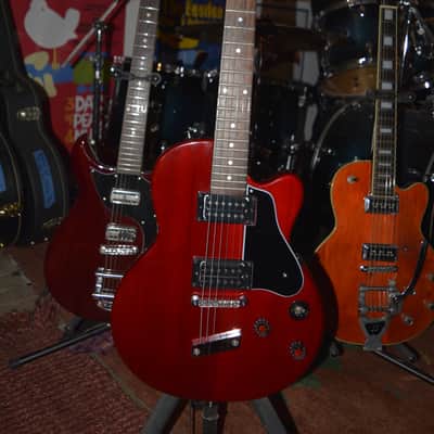 DeArmond M-65, in Red w/New Nickel Dunlop Straploks, a New Black pickguard, New Skull knobs & Nice SKB HSC image 1