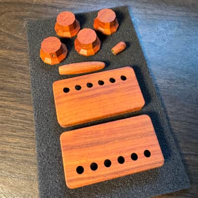 Guilford Padauk Holy Grail Combo - 4) 1122 Facet Cut Knobs (1.5mm set screw/6mm shaft), 2) Humbucker Covers (PRS/Seymour Duncan Pole Spacing), 1) Tremolo Tip (3/16” Shaft fits Fender/PRS USA), 1) 3 way toggle knob (fits Switchcraft USA) image 1