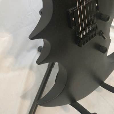 Trinity Bat-el'-ax image 3