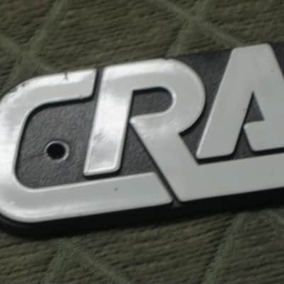 used - some imperfections genuine Crate bass amp Crate LOGO Plate (badge)- hard plastic - with 2 original screws (from a BX15 or BX25 bass amp - NO bass amp included) 1990s - early 2000s - Hard Plastic, white & black image 21