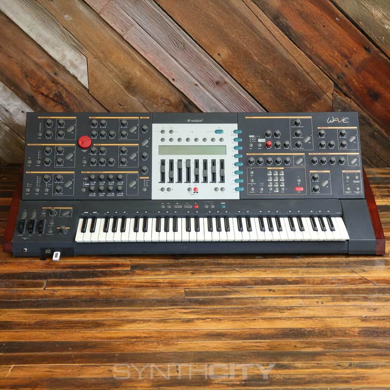 Waldorf synthesizer keyboard with dark gray and black paneling.