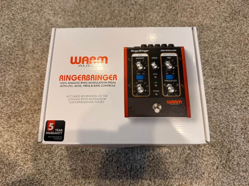 Black and silver audio effects pedal with knobs and switches.