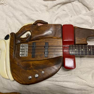 Very unique bass guitar. Hand made carved bull dog body image 1