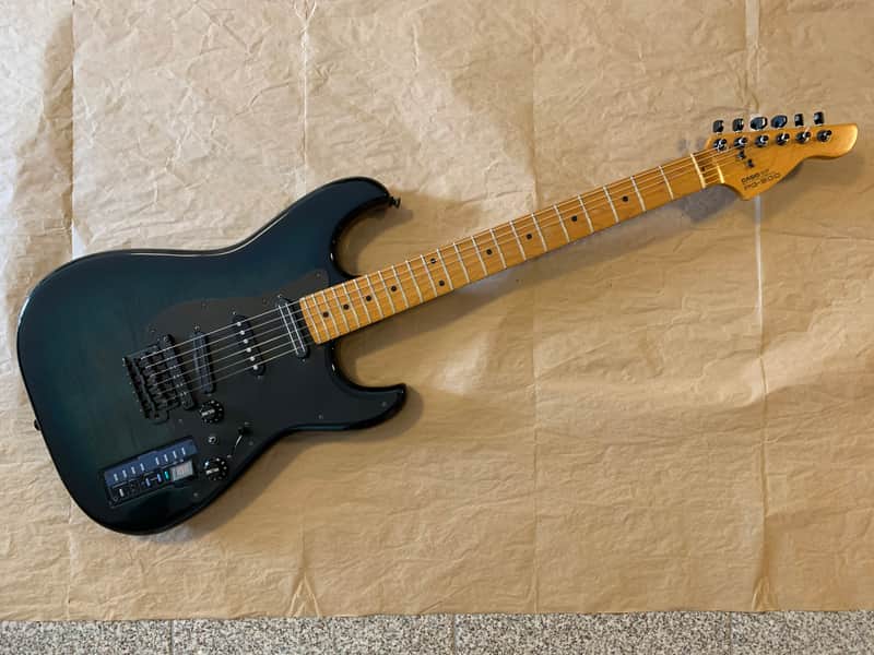 Casio PG-300 Turquioseburst Flame electric guitar with Midi and