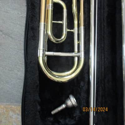 New Gold color trigger trombone. With case and mouthpiece. image 3