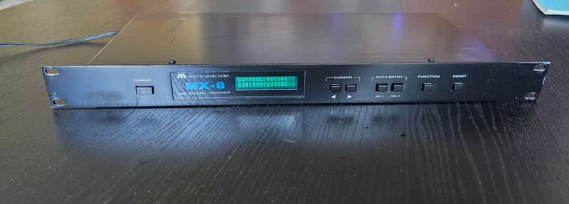 Digital Music Corporation (DMC) Digital Music Corporation (DMC) MX-8  1U rack-mount MIDI patch bay and real-time data processor  1980's - black image 1