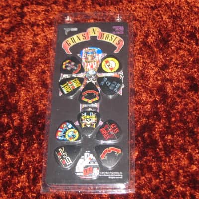 new in package (old stock) A+ Perri's Leather Ltd. / Perri's 12 Pack Of Guns N Roses Guitar Picks - Med Gauge - Celluloid Plastic, 351 shape - but slightly curved (LP12-GNR1) LP12GNR1 image 1