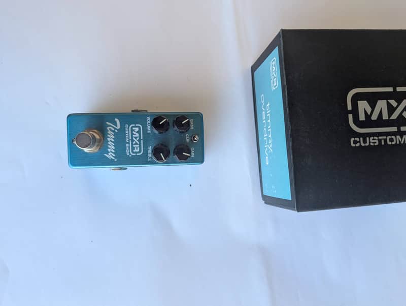 Black MXR custom shop box, Dunlop Quick Guide, MXR logo, small blue pedal.