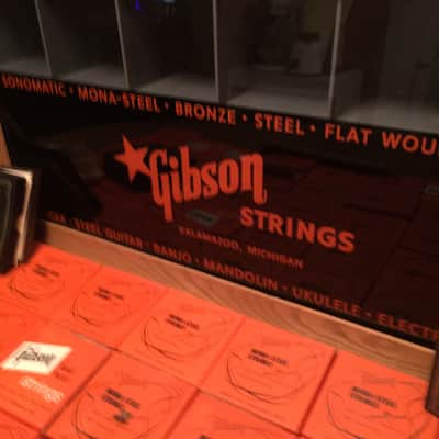Gibson String Display case 1950's -60's orange and black full of unused strings image 2