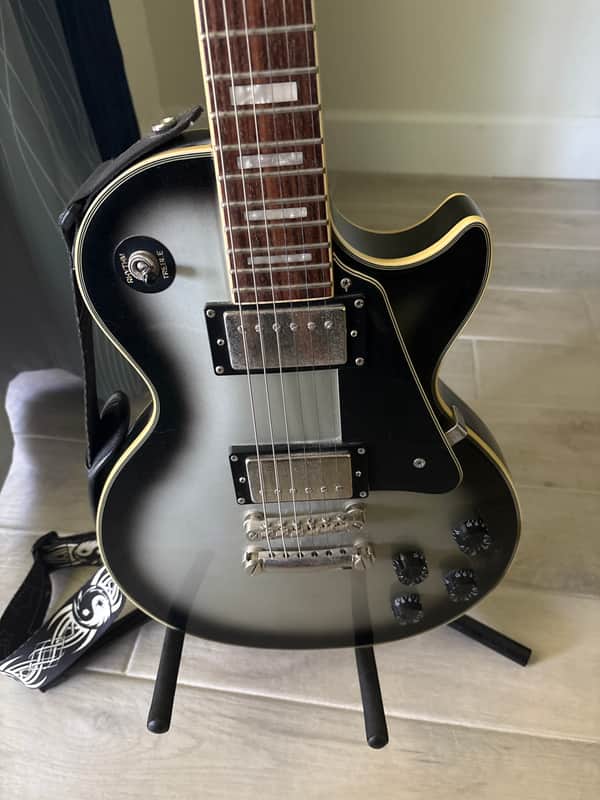 Epiphone Les Paul Custom in a Silverburst finish image 1