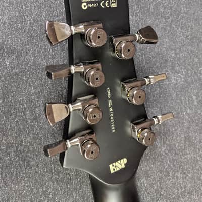 LTD Hex-7 Nergal Signature 7-String Electric Guitar Matte Black w/ Flying V Case image 14