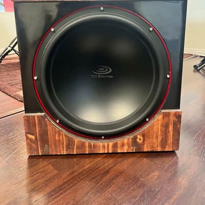 Exquisite TC Sounds LMS Ultra 5400 18" Subwoofer - Pristine Condition, sleek black satin, striking red trim, and luxurious wood grain base. image 1