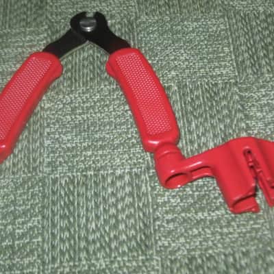 new old stock open package A+ D'Addario / Planet Waves 1st ver Pro-Winder RED String Winder & Cutter & Bridge PIn Puller, has different handle design than current DP0002 model,  from 2000s - for guitars, banjos, ukuleles, and mandolins image 15