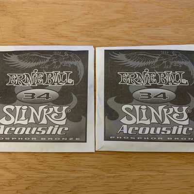 Two Single .034 Gauge Slinky Acoustic Guitar Strings (Ernie Ball - Bronze) Opened, Not Played image 1