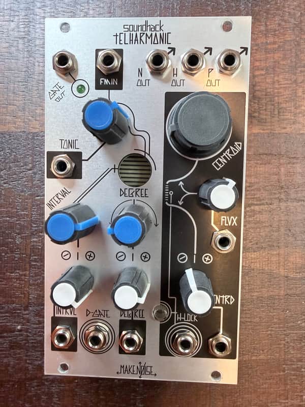 Silver and black electronic sound module with knobs and jacks.