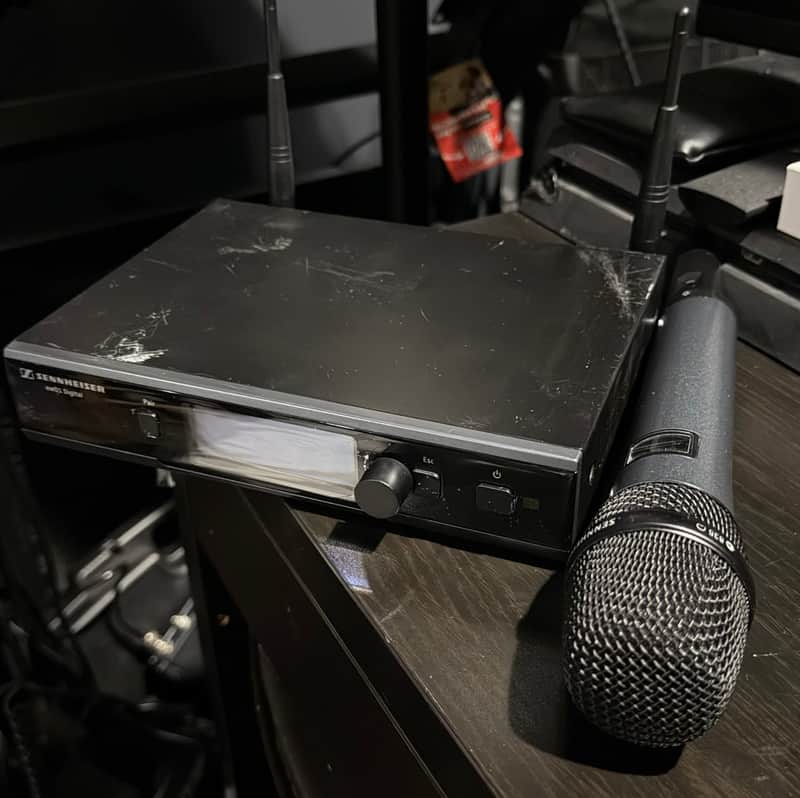 Black box featuring wireless microphone and receiver; Sennheiser branding visible.