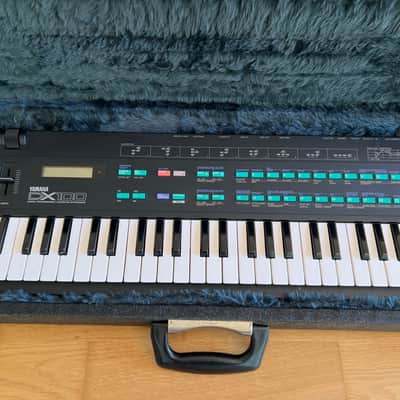Yamaha DX100 4-Operator FM Synthesizer (1985) - Excellent Condition with Flight Case, Original Manual & Power Supply