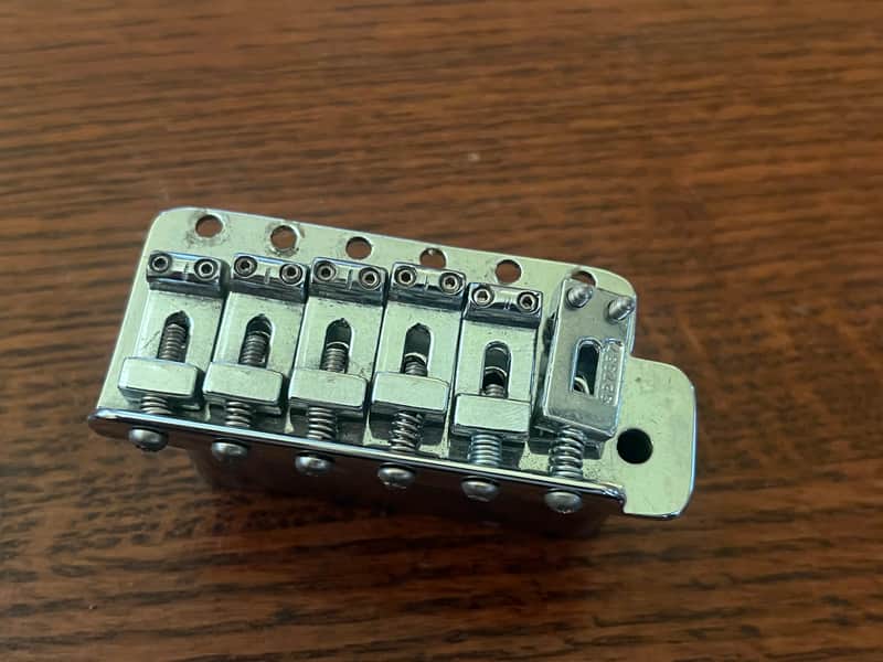 1970s Fender Stratocaster guitar tremolo bridge stamped saddles image 1